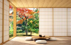 Japanskt rum med bord och stolar och öppen vägg mot trädgården